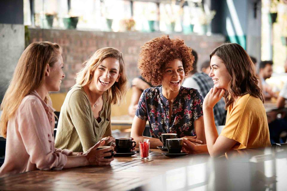 Women talking and laughing together representing outpatient rehab support group in New Jersey